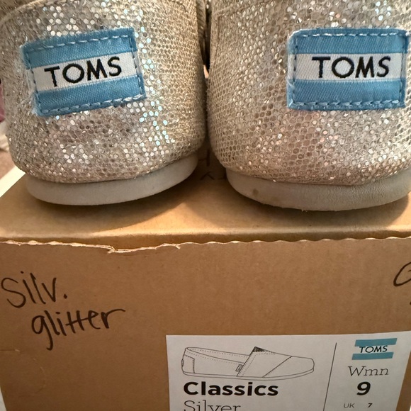 TOMS Silver Glitter Slip-Ons - Picture 1 of 5